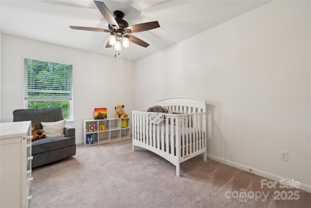5113 Saddleback Dr, Mount Holly, NC 28120 - bedroom featuring carpet flooring, a nursery area, a ceiling fan, and baseboards