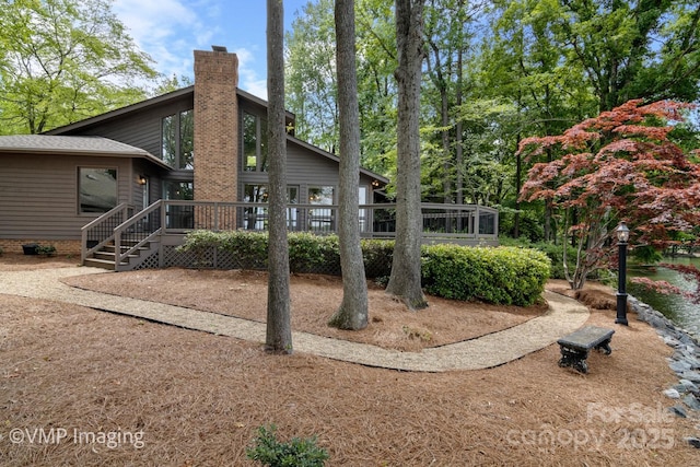 449 Windward Dr, Davidson, NC 28036 - back of property featuring a wooden deck, a chimney, crawl space, and a shingled roof