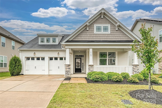 2760 Berkhamstead Cir, Concord, NC 28027 - craftsman house with a porch, an attached garage, driveway, a front lawn, and stone siding
