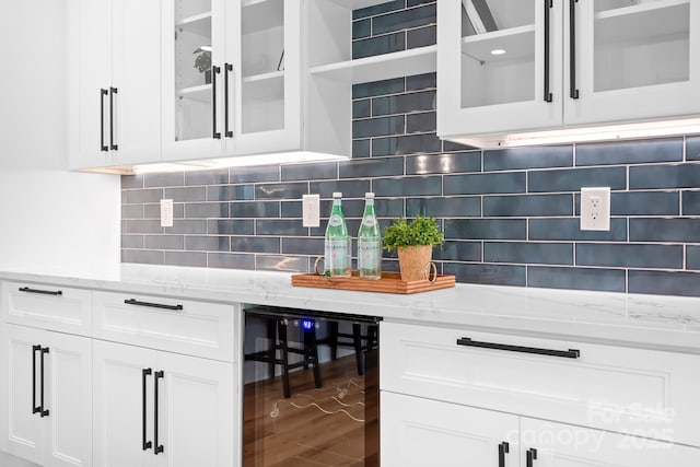 106 Arbor Dr, Waxhaw, NC 28173 - kitchen featuring wine cooler, white cabinets, and light stone counters