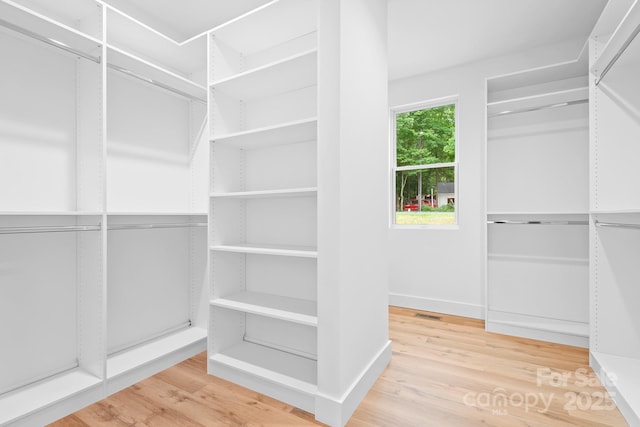 106 Arbor Dr, Waxhaw, NC 28173 - walk in closet with wood finished floors