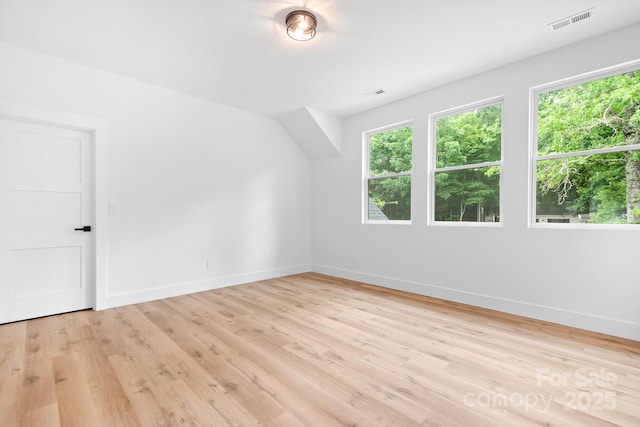 106 Arbor Dr, Waxhaw, NC 28173 - bonus room with plenty of natural light, baseboards, and light wood-style flooring