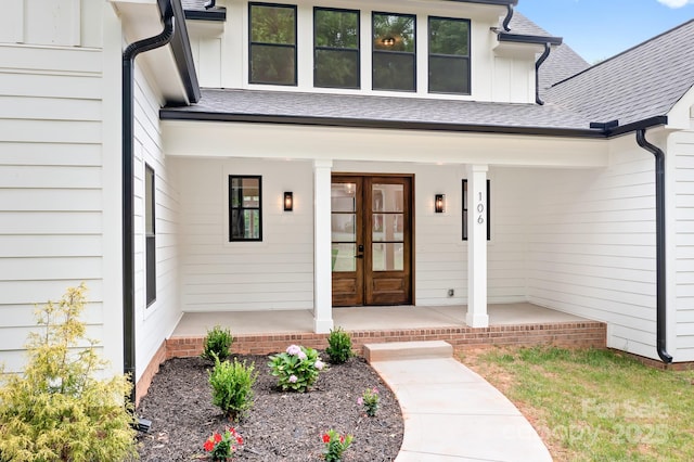 106 Arbor Dr, Waxhaw, NC 28173 - doorway to property featuring board and batten siding, french doors, covered porch, and a shingled roof