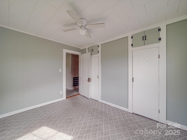201 Robinson Rd, Gastonia, NC 28056 - unfurnished bedroom with light carpet, baseboards, and a ceiling fan