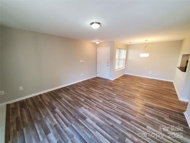 5003 Sharon Rd Unit Q, Charlotte, NC 28210 - unfurnished living room with dark wood-type flooring and baseboards