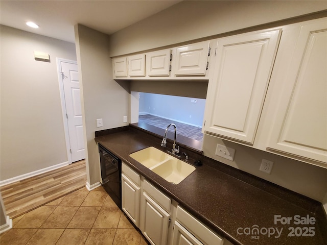 5003 Sharon Rd Unit Q, Charlotte, NC 28210 - kitchen with a sink, dishwasher, dark countertops, white cabinetry, and recessed lighting