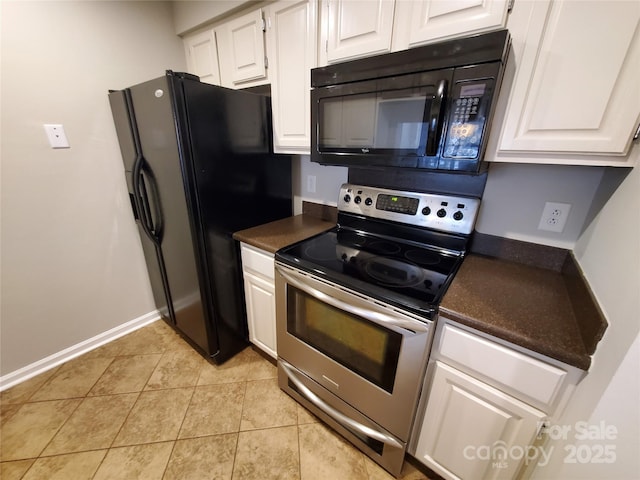 5003 Sharon Rd Unit Q, Charlotte, NC 28210 - kitchen with black appliances, dark countertops, white cabinetry, and light tile patterned flooring