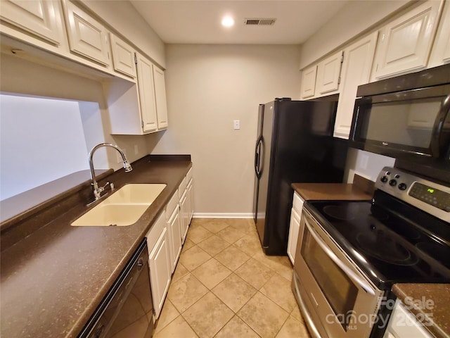 5003 Sharon Rd Unit Q, Charlotte, NC 28210 - kitchen featuring black appliances, a sink, white cabinetry, baseboards, and light tile patterned flooring