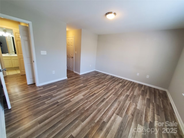 5003 Sharon Rd Unit Q, Charlotte, NC 28210 - unfurnished bedroom with dark wood-style floors and baseboards