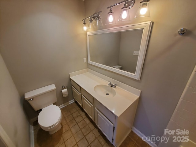 5003 Sharon Rd Unit Q, Charlotte, NC 28210 - bathroom with toilet, vanity, tile patterned flooring, and baseboards