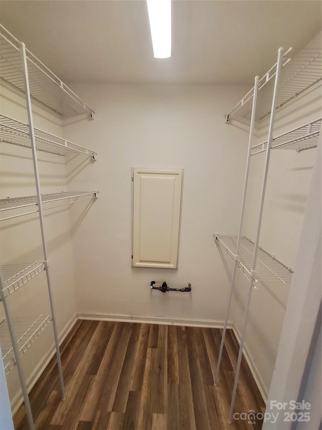 5003 Sharon Rd Unit Q, Charlotte, NC 28210 - walk in closet with dark wood finished floors