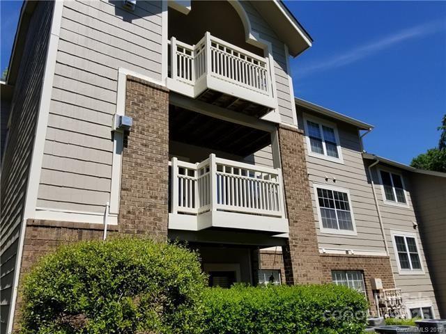 5003 Sharon Rd Unit Q, Charlotte, NC 28210 - view of property exterior with a balcony and brick siding