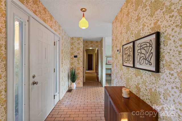 55 Dane Acres Dr, Alexander, NC 28701 - hallway featuring wallpapered walls, a textured ceiling, and baseboards