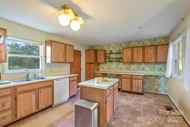 55 Dane Acres Dr, Alexander, NC 28701 - kitchen with white dishwasher, wallpapered walls, a sink, open shelves, and baseboards