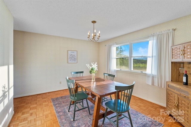 55 Dane Acres Dr, Alexander, NC 28701 - dining area featuring a chandelier, a textured ceiling, baseboards, and wallpapered walls