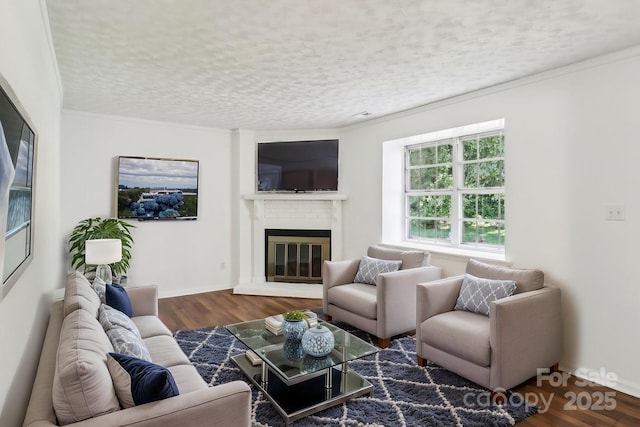 8510 Castle Pine Ct, Charlotte, NC 28226 - living area with a glass covered fireplace, crown molding, wood finished floors, a textured ceiling, and baseboards