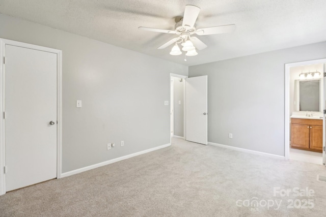 8510 Castle Pine Ct, Charlotte, NC 28226 - unfurnished bedroom featuring light colored carpet, connected bathroom, baseboards, a textured ceiling, and ceiling fan