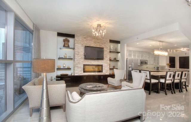 333 W Trade St Unit 1304, Charlotte, NC 28202 - living room with a chandelier and a large fireplace