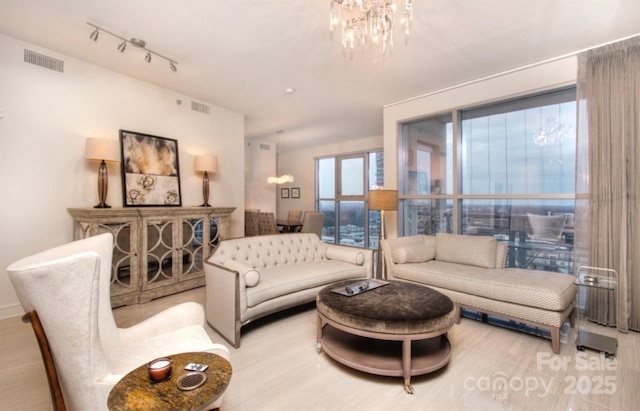 333 W Trade St Unit 1304, Charlotte, NC 28202 - living room with a chandelier and wood finished floors