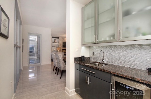 333 W Trade St Unit 1304, Charlotte, NC 28202 - indoor wet bar with tasteful backsplash, baseboards, and beverage cooler