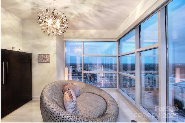 333 W Trade St Unit 1304, Charlotte, NC 28202 - living area with a chandelier, a view of city, and light tile patterned floors