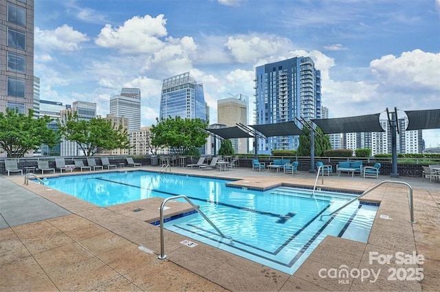 333 W Trade St Unit 1304, Charlotte, NC 28202 - community pool with a view of skyline and a patio