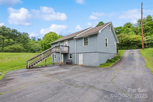 48 Medford Ave, Waynesville, NC 28786 - view of front of home featuring stairway, roof with shingles, a front yard, and a deck