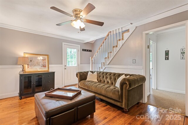 48 Medford Ave, Waynesville, NC 28786 - living area with stairway, ornamental molding, ceiling fan, and wood finished floors