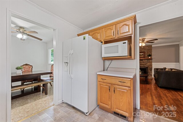 48 Medford Ave, Waynesville, NC 28786 - kitchen with white appliances, a ceiling fan, crown molding, and light countertops