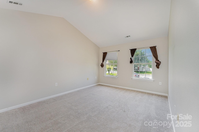 8524 Emerald Fern Way, Charlotte, NC 28214 - carpeted empty room with vaulted ceiling and baseboards
