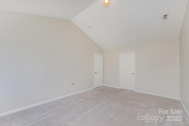 8524 Emerald Fern Way, Charlotte, NC 28214 - empty room with lofted ceiling, light colored carpet, and baseboards