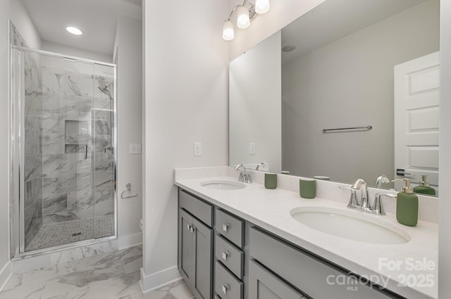 235 S Bruns Ave, Charlotte, NC 28208 - full bathroom featuring baseboards, marble finish floors, double vanity, a marble finish shower, and toilet
