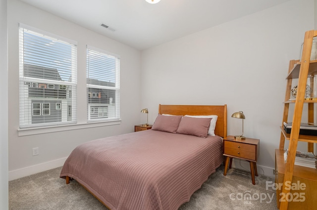 235 S Bruns Ave, Charlotte, NC 28208 - carpeted bedroom featuring baseboards