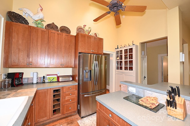 616 N Deal Ave, Newton, NC 28658 - kitchen with stainless steel fridge with ice dispenser, light wood-type flooring, a ceiling fan, and brown cabinetry
