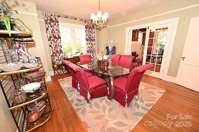 616 N Deal Ave, Newton, NC 28658 - dining room featuring a chandelier, wood finished floors, french doors, and baseboards