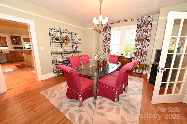 616 N Deal Ave, Newton, NC 28658 - dining room with a chandelier and light wood-type flooring