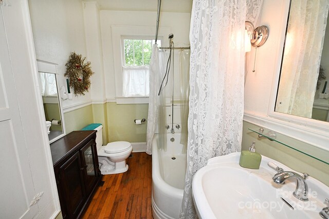616 N Deal Ave, Newton, NC 28658 - bathroom with toilet, a sink, wood finished floors, and shower / tub combo with curtain
