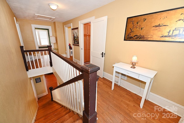 616 N Deal Ave, Newton, NC 28658 - stairs featuring attic access, wood finished floors, and baseboards
