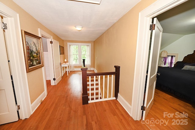 616 N Deal Ave, Newton, NC 28658 - corridor featuring an upstairs landing, wood finished floors, and baseboards