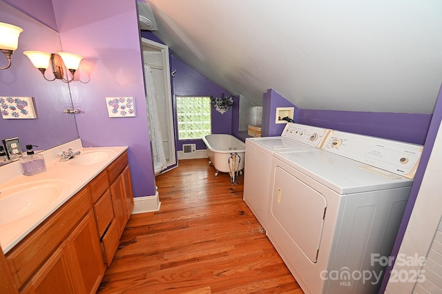 616 N Deal Ave, Newton, NC 28658 - laundry area with washer and clothes dryer and light wood-type flooring