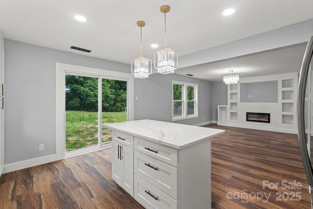3124 Pikes Peak Dr, Gastonia, NC 28052 - kitchen featuring a chandelier, recessed lighting, dark wood-style flooring, baseboards, and white cabinetry