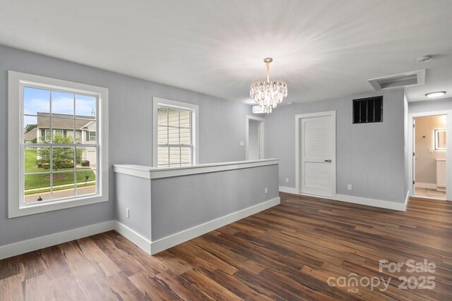 3124 Pikes Peak Dr, Gastonia, NC 28052 - unfurnished room featuring plenty of natural light, baseboards, and dark wood-style flooring