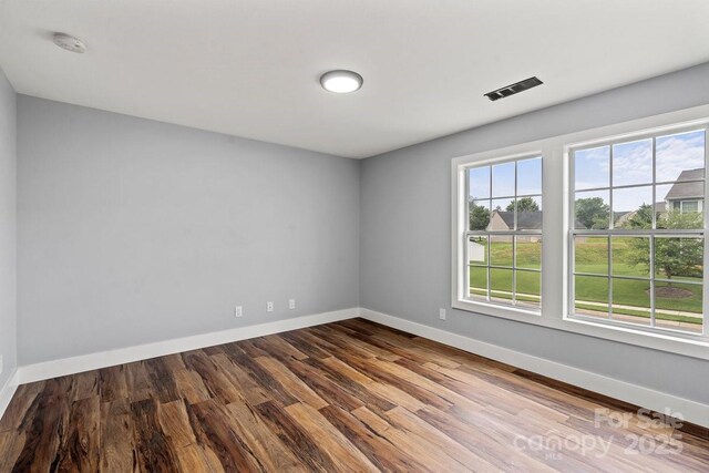 3124 Pikes Peak Dr, Gastonia, NC 28052 - empty room featuring wood finished floors, baseboards, and a smoke detector