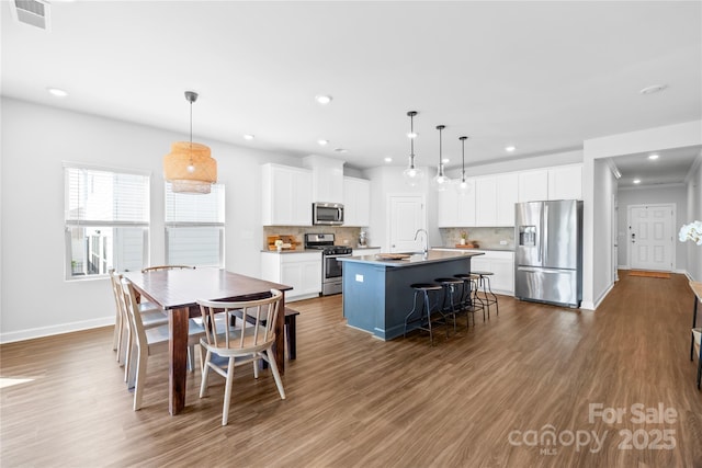 3938 Isenhour Rd, Kannapolis, NC 28081 - dining space with baseboards, dark wood-style floors, and recessed lighting
