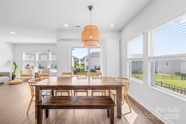 3938 Isenhour Rd, Kannapolis, NC 28081 - dining area with healthy amount of natural light, wood finished floors, baseboards, and recessed lighting