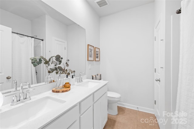 3938 Isenhour Rd, Kannapolis, NC 28081 - full bathroom featuring double vanity, tile patterned floors, toilet, a shower with shower curtain, and baseboards