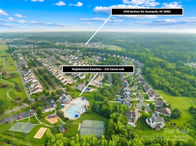3938 Isenhour Rd, Kannapolis, NC 28081 - aerial perspective of suburban area featuring a pool and a heavily wooded area