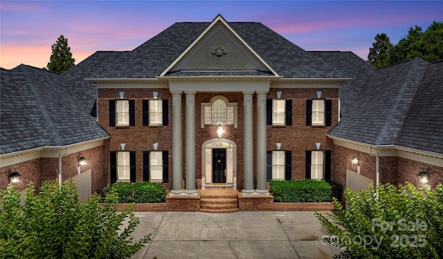 8721 Lake Challis Ln, Charlotte, NC 28226 - greek revival inspired property with brick siding and roof with shingles