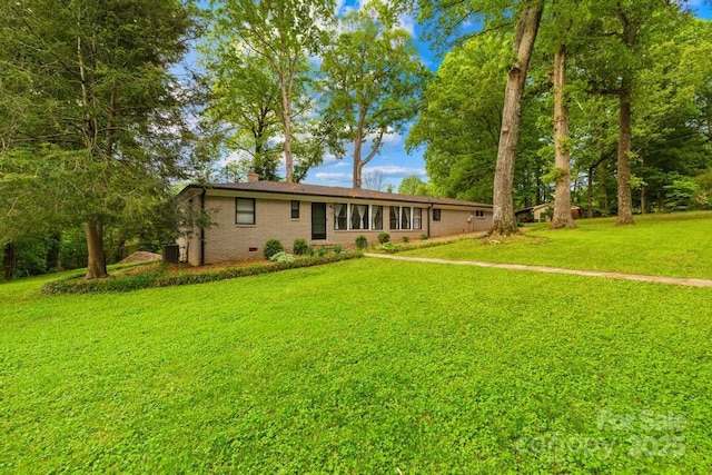 7022 Lakeside Dr, Charlotte, NC 28215 - ranch-style house featuring a chimney, a front lawn, crawl space, brick siding, and central AC unit