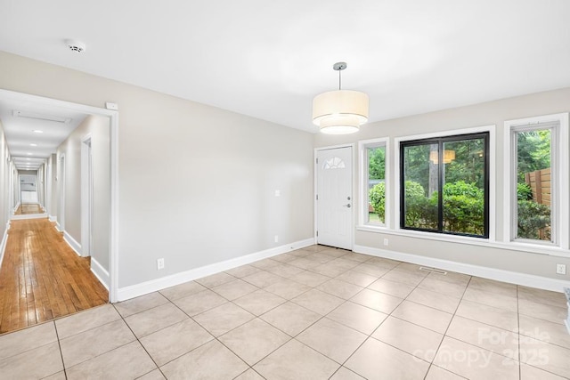 7022 Lakeside Dr, Charlotte, NC 28215 - entrance foyer featuring baseboards and light tile patterned flooring